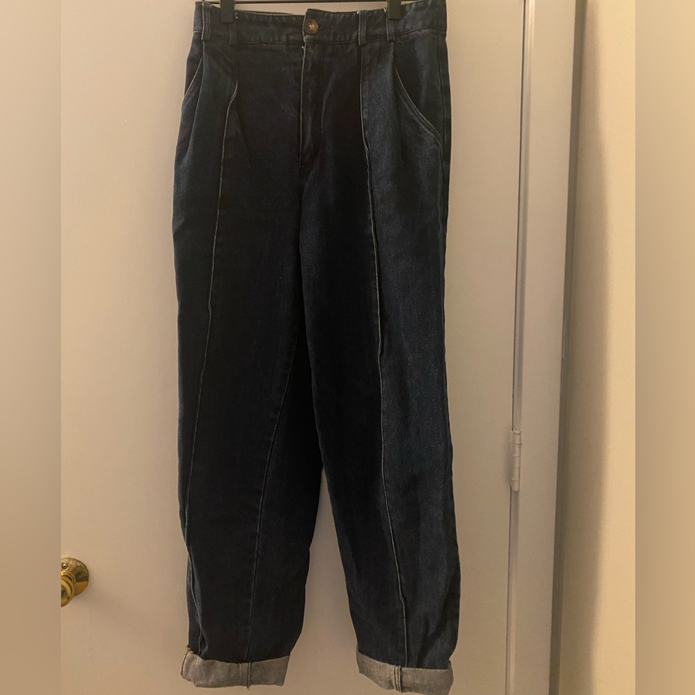 Vintage tapered jeans with subtle pattern.
